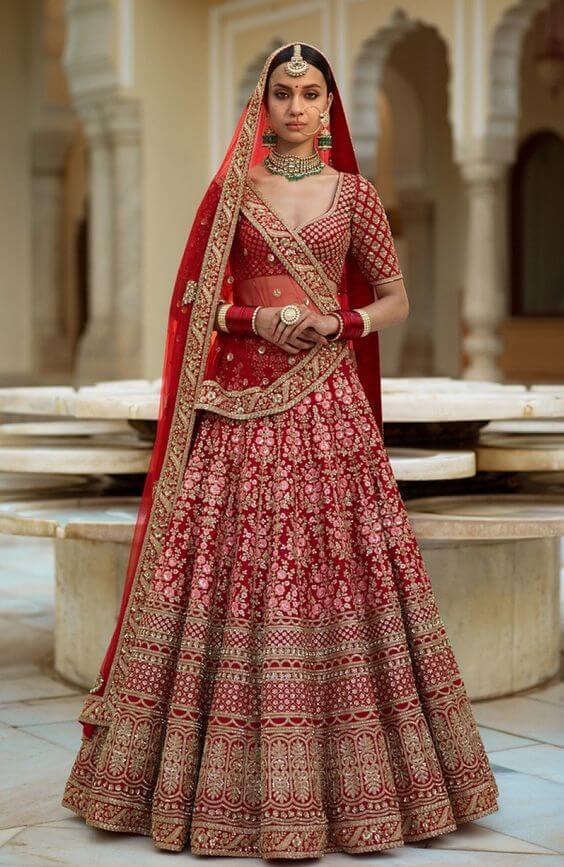 Draped in the allure of blood-red enchantment, this breathtaking bridal  lehenga is a masterpiece of intricate embroidery. The rich, vibr... |  Instagram